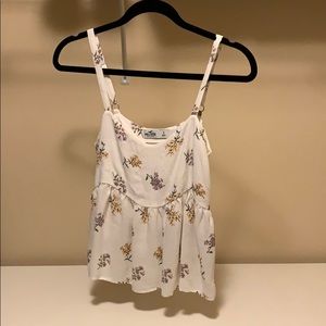 White tank top with a floral pattern.